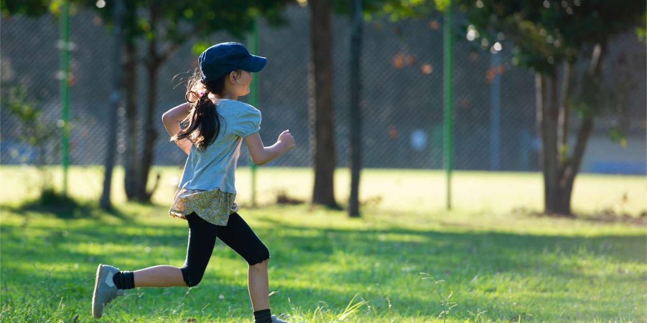 Healthy child playing outdoors, symbolizing strong natural immunity and vitality.