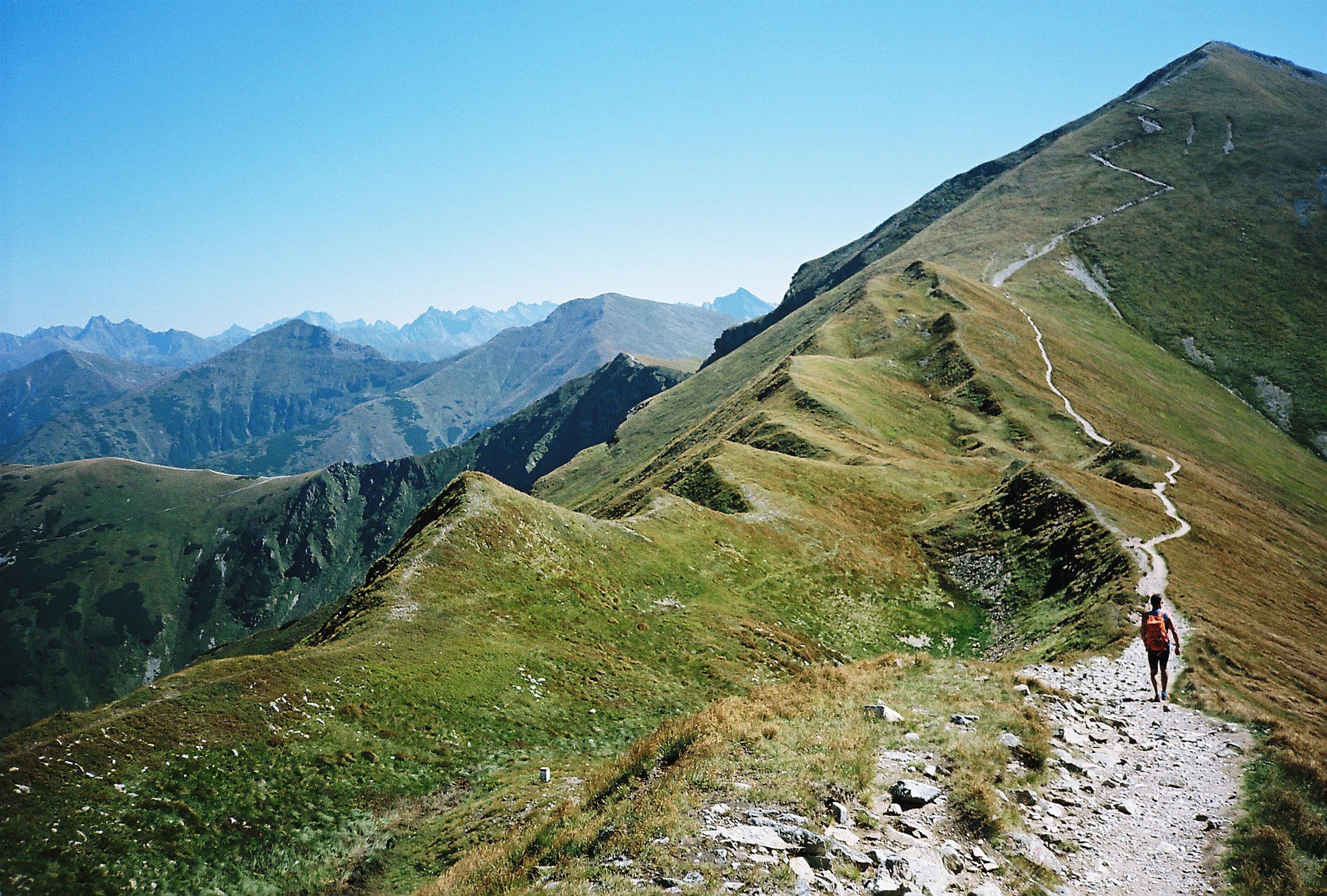 A walker on a wild Slovak ridge under an open sky