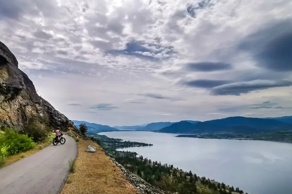 Kettle Valley Rail Trail passing vineyards and trestles in the Okanagan