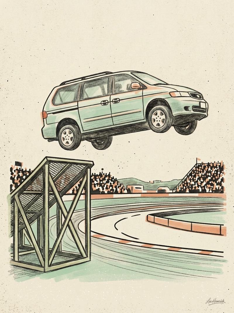 An uncaged road-legal minivan mid-air above a portable jump ramp at Stafford Motor Speedway during the Van Prix undercard race.
