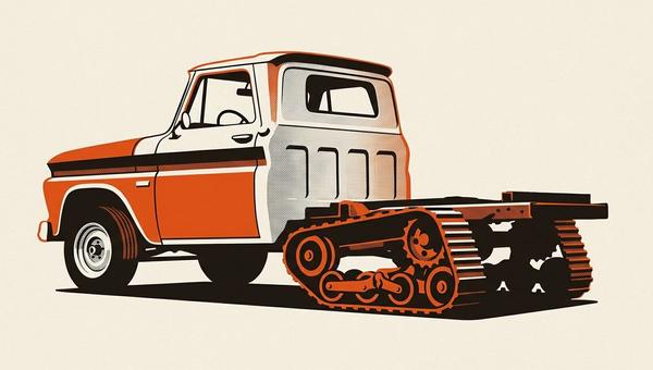 Barn-find vintage pickup half-track build, mid-restoration with rear track system installed and front wheels still fitted.