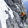 Climber scaling a mountain