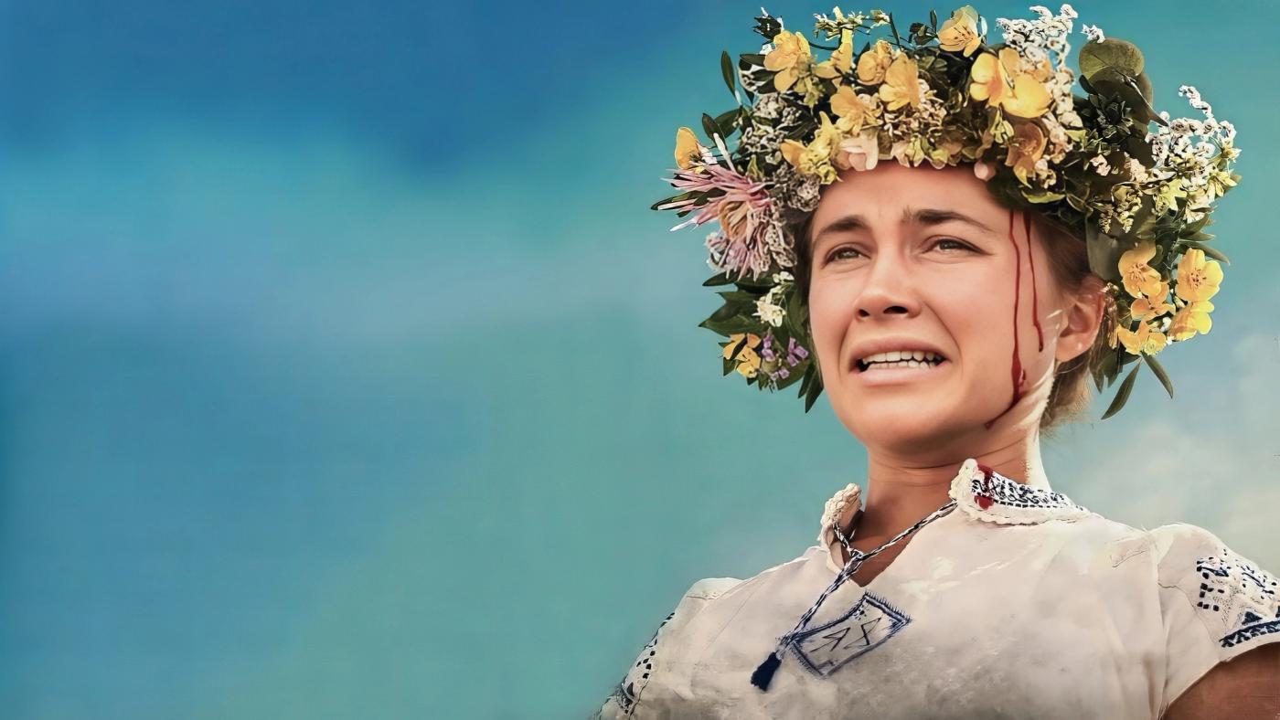Dani menangis dengan darah di leher mengenakan mahkota bunga dalam adegan akhir Midsommar