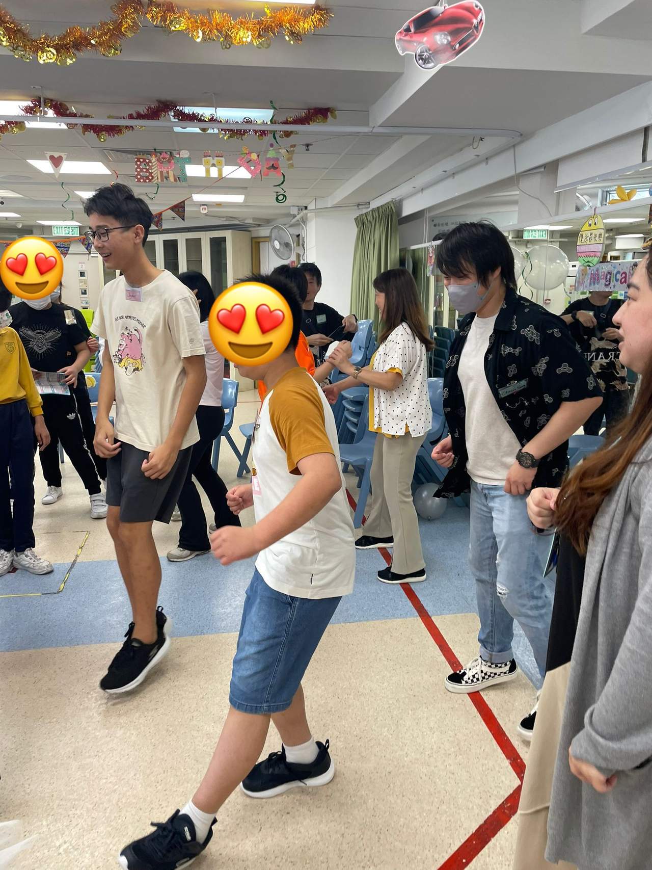 Participants move between chairs during an indoor game.