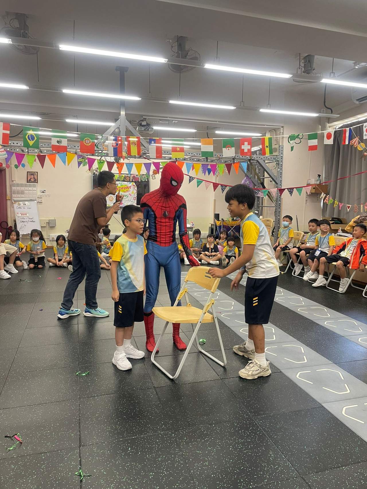 Children participate in a game with a costumed performer.