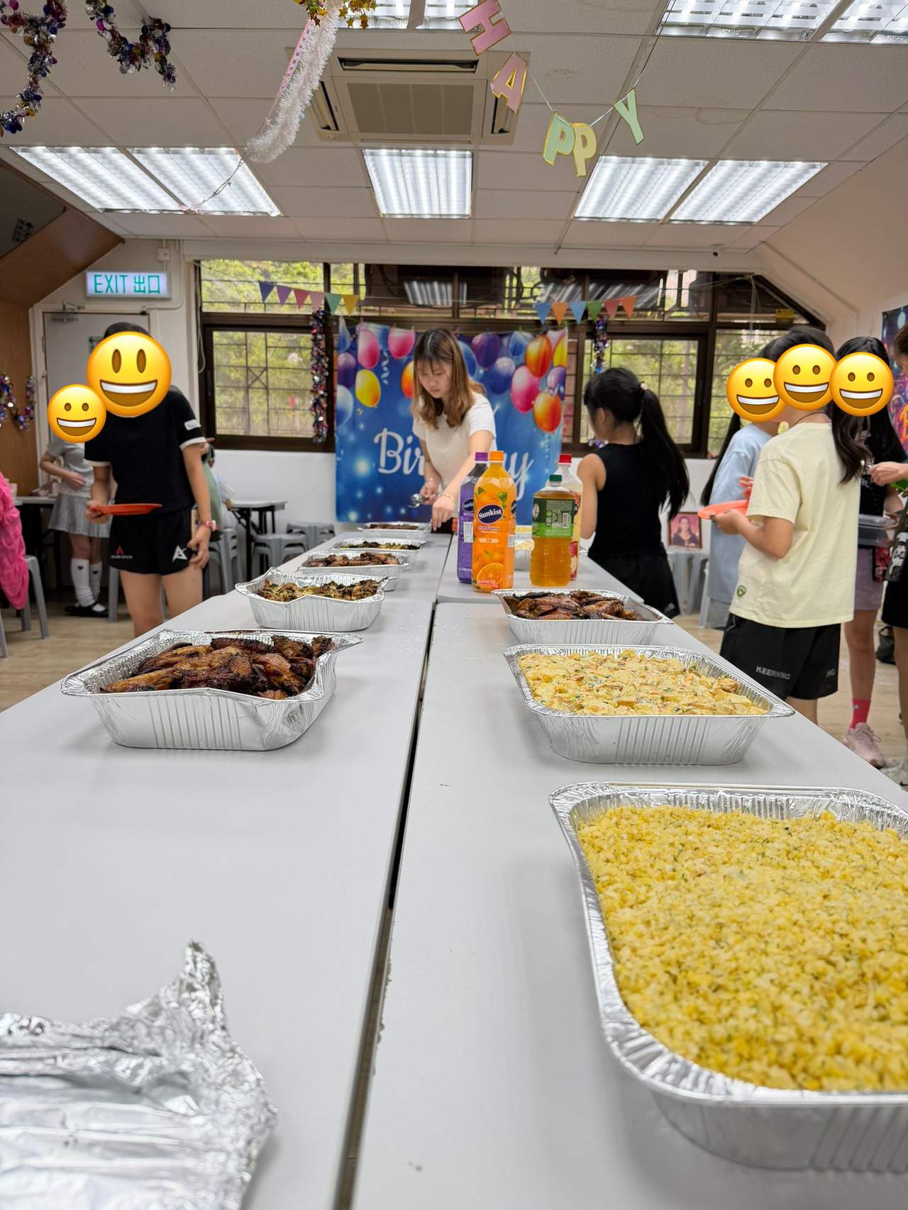 Trays of food are arranged for a shared meal.