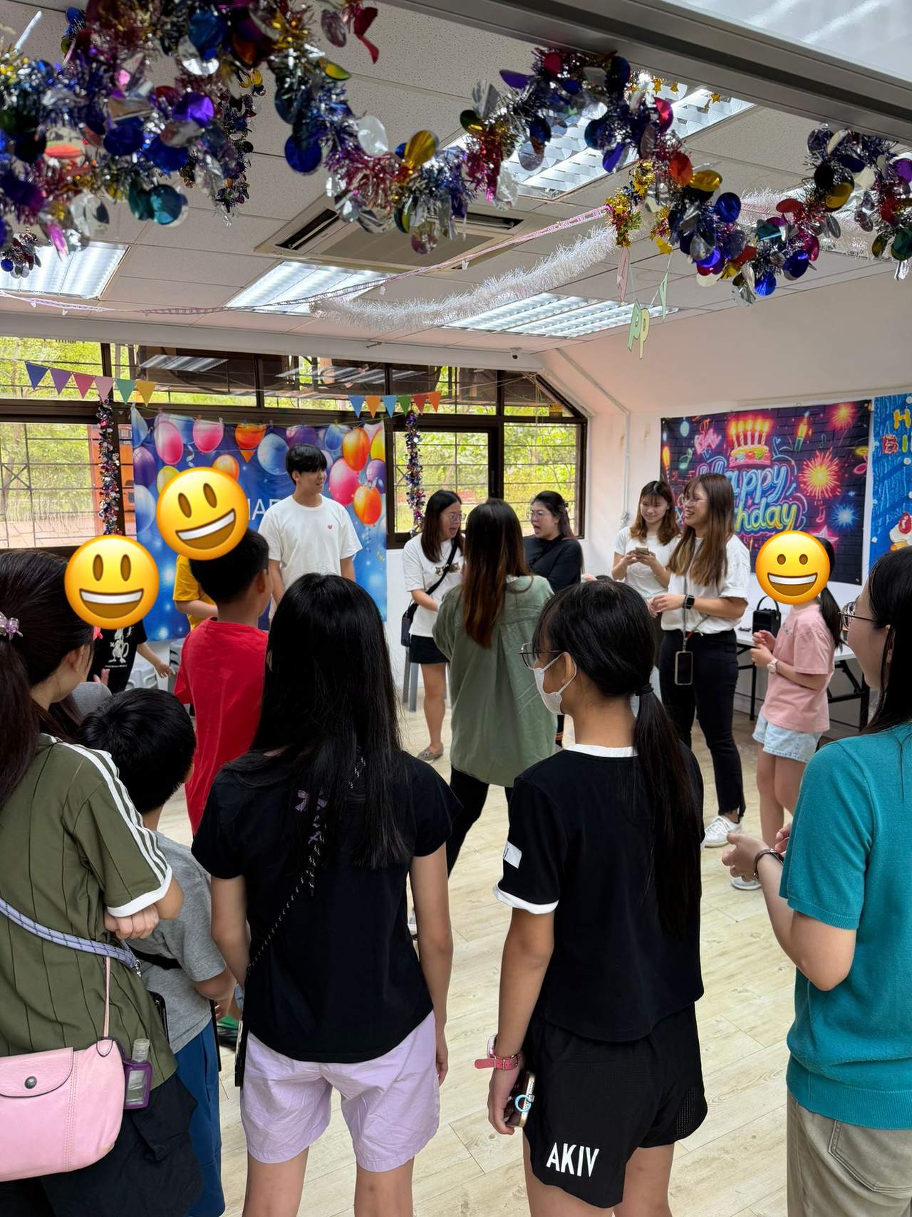 Participants stand together during a group activity.