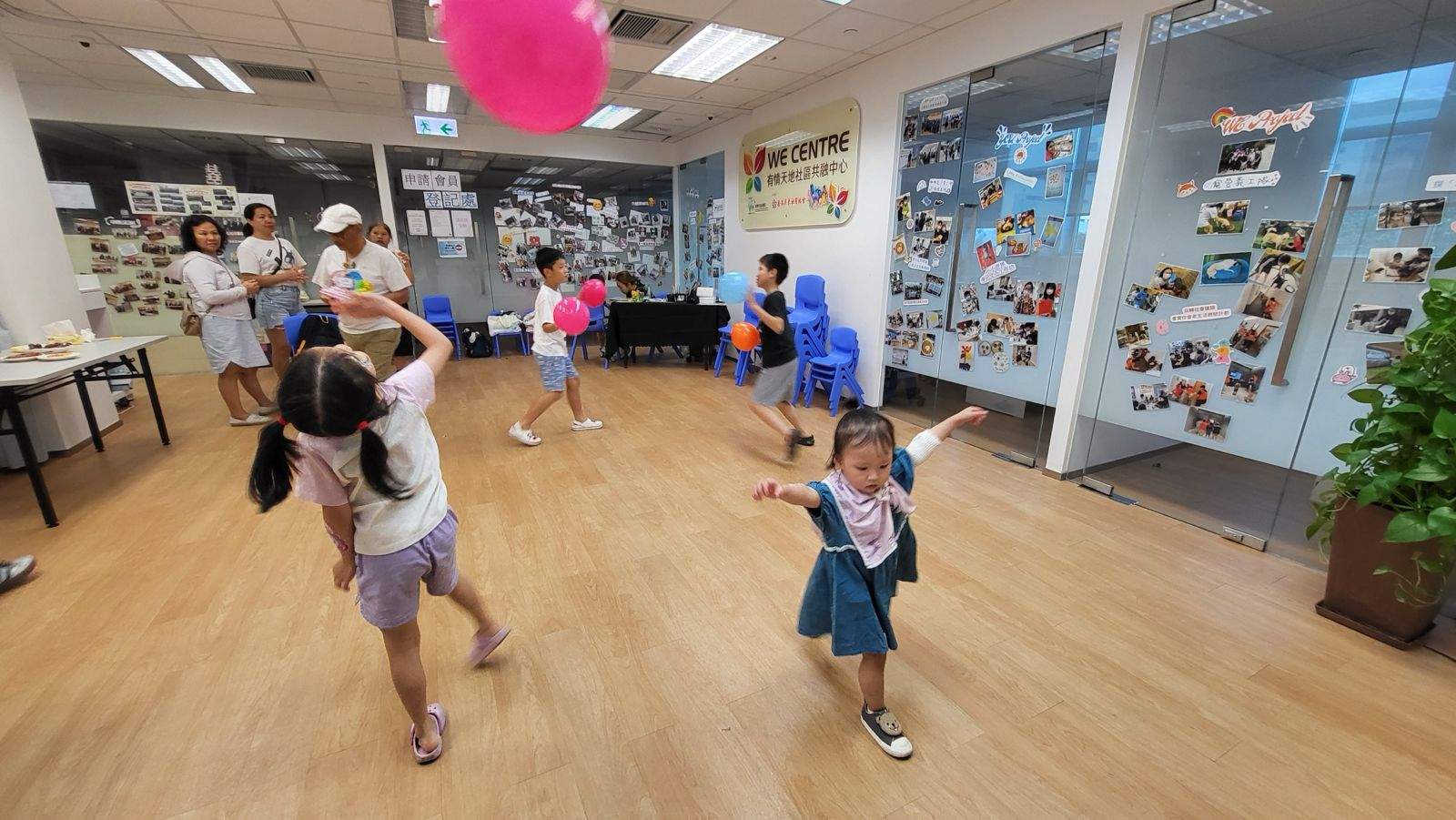 Children move across the room during an active group game.