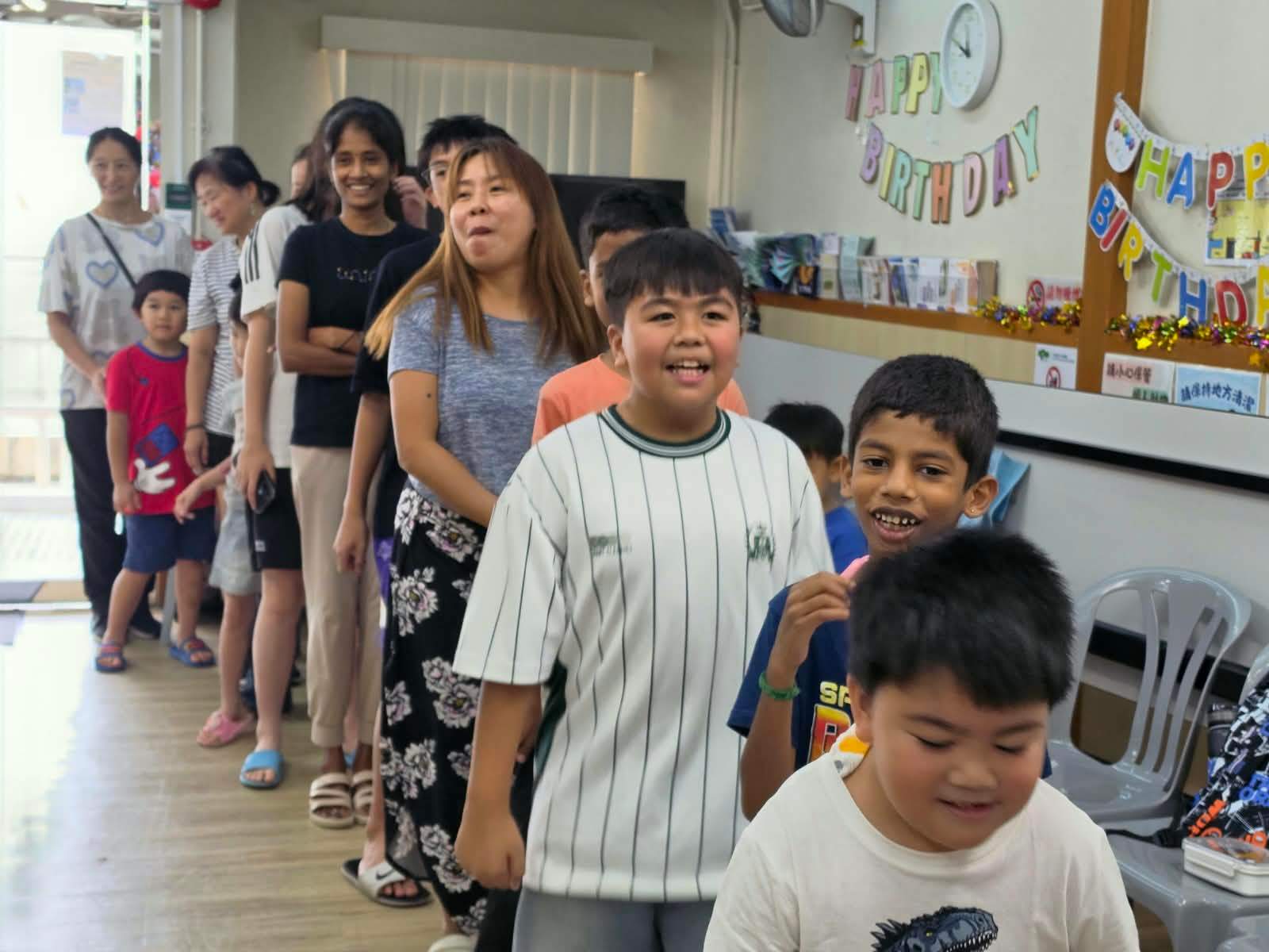 Children line up for a group activity.