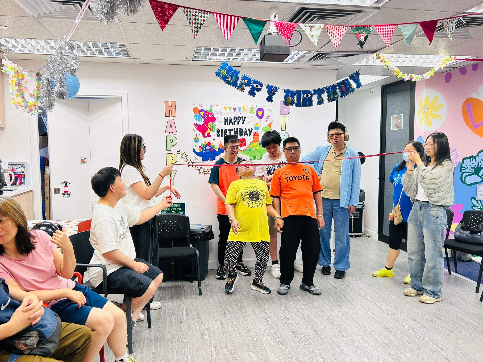 Participants stand at the front during a group activity.