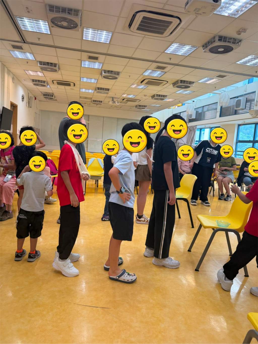 Participants stand together between turns in a party game.