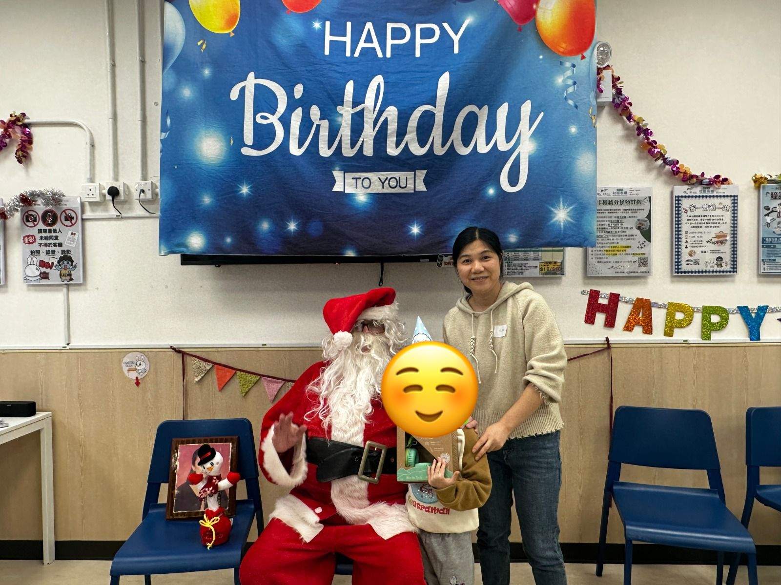 A costumed adult poses with a child and another adult.