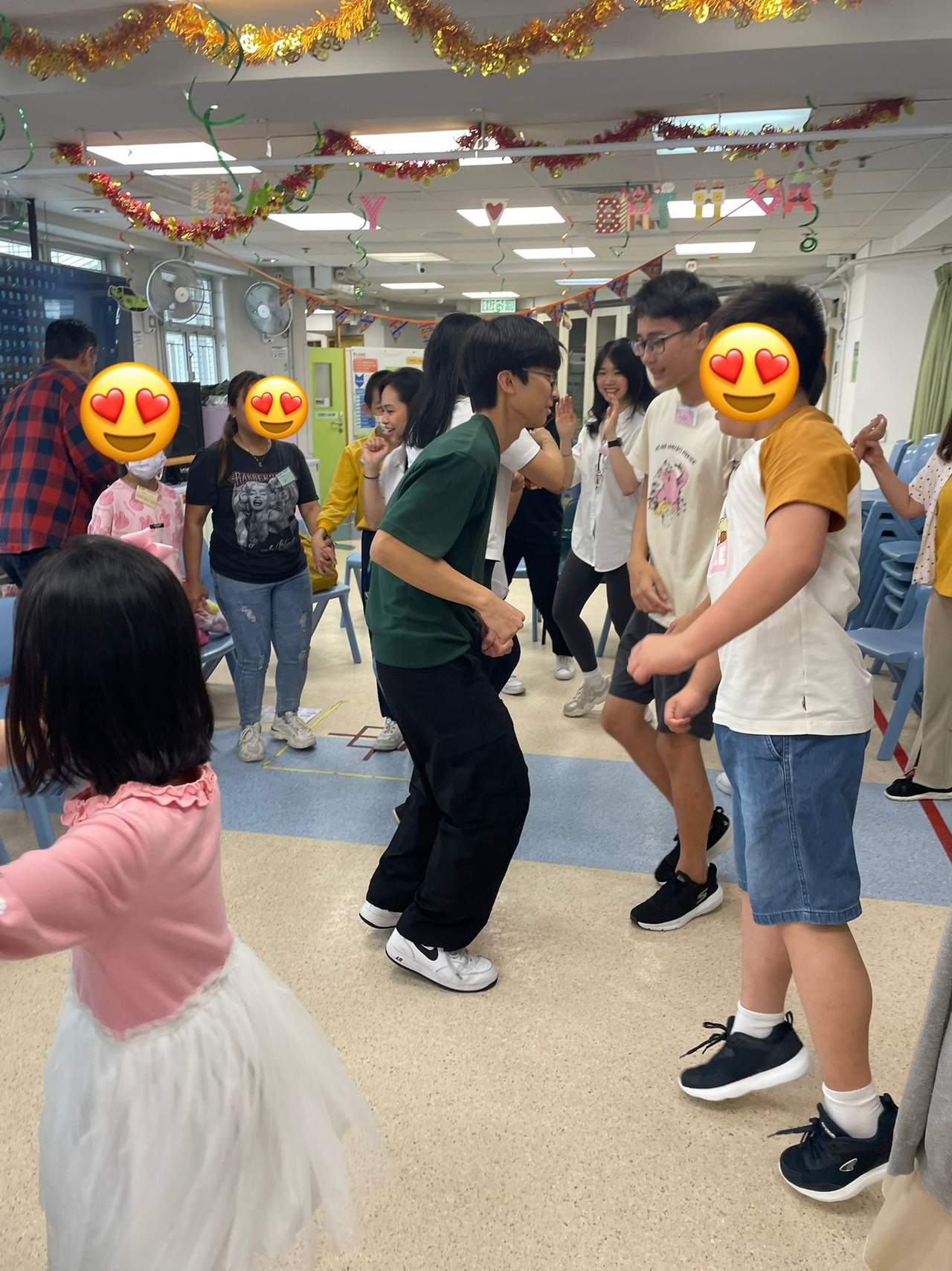 People gather in the decorated room during a group activity.