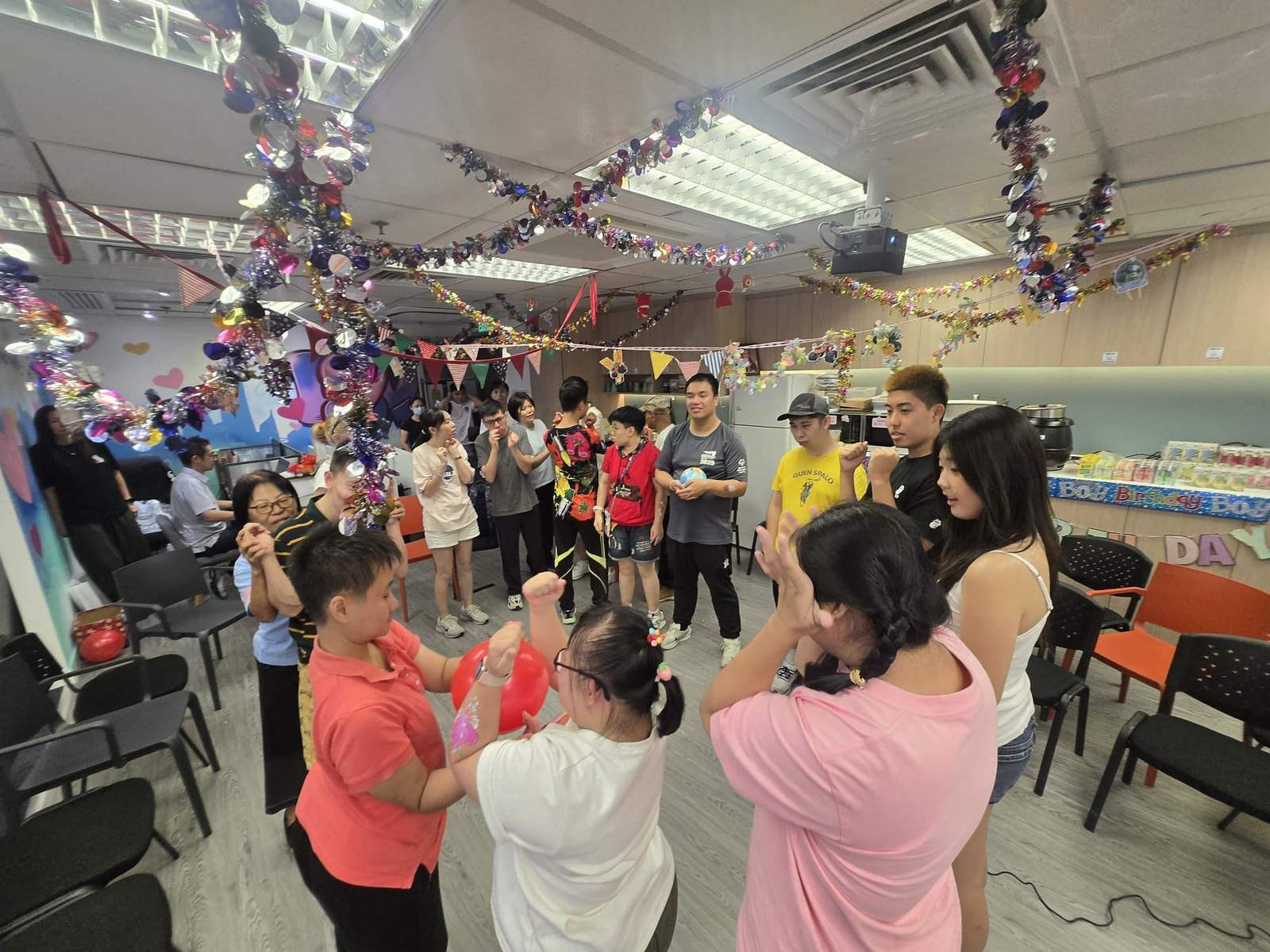 Participants gather in a circle during an energetic group game.