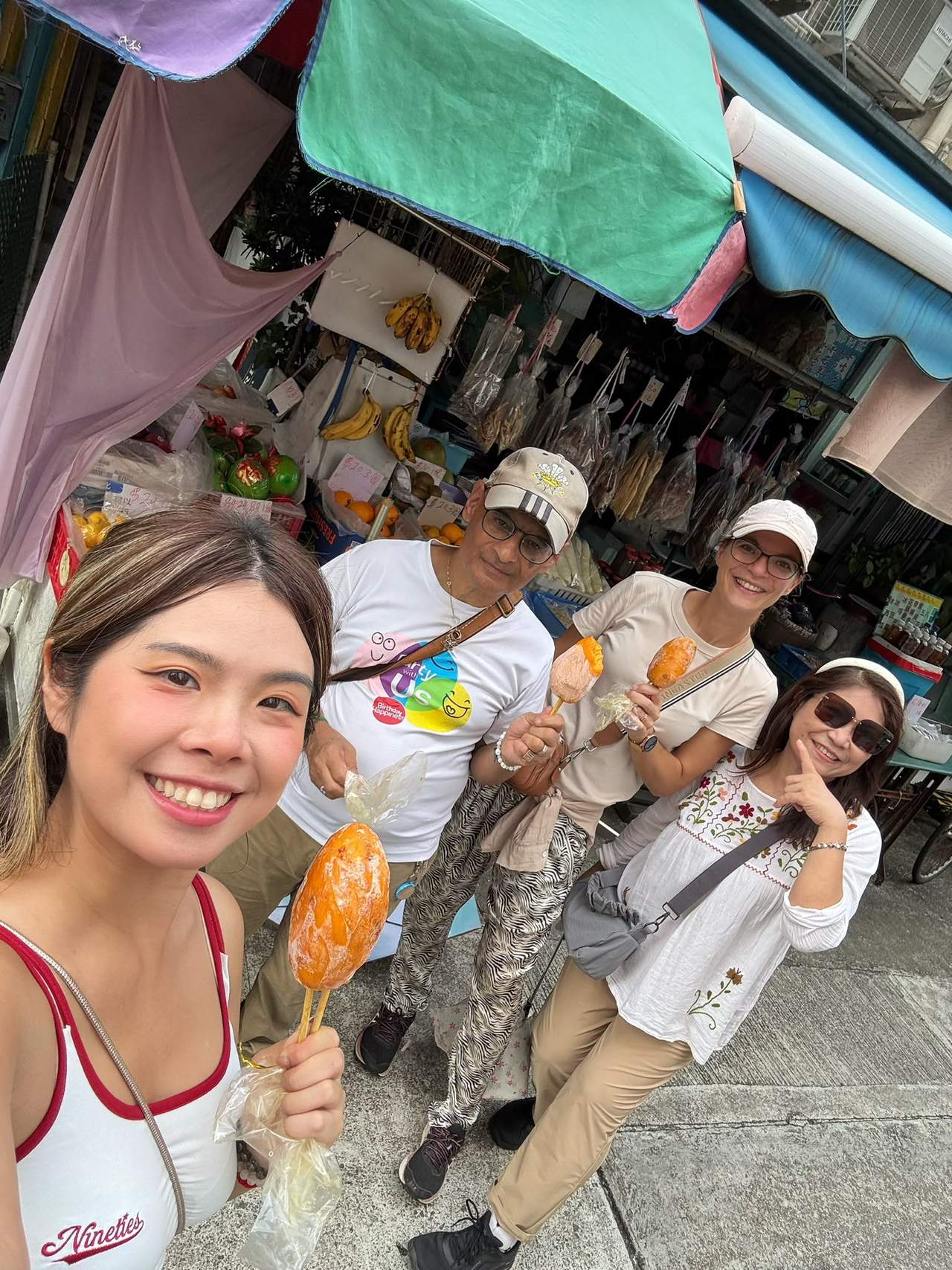 Volunteers enjoy a snack together during the Tai O tour.
