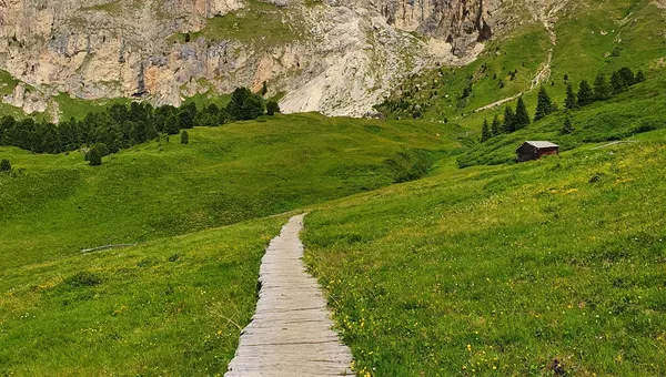 Ancient streets church with Dolomites in the background