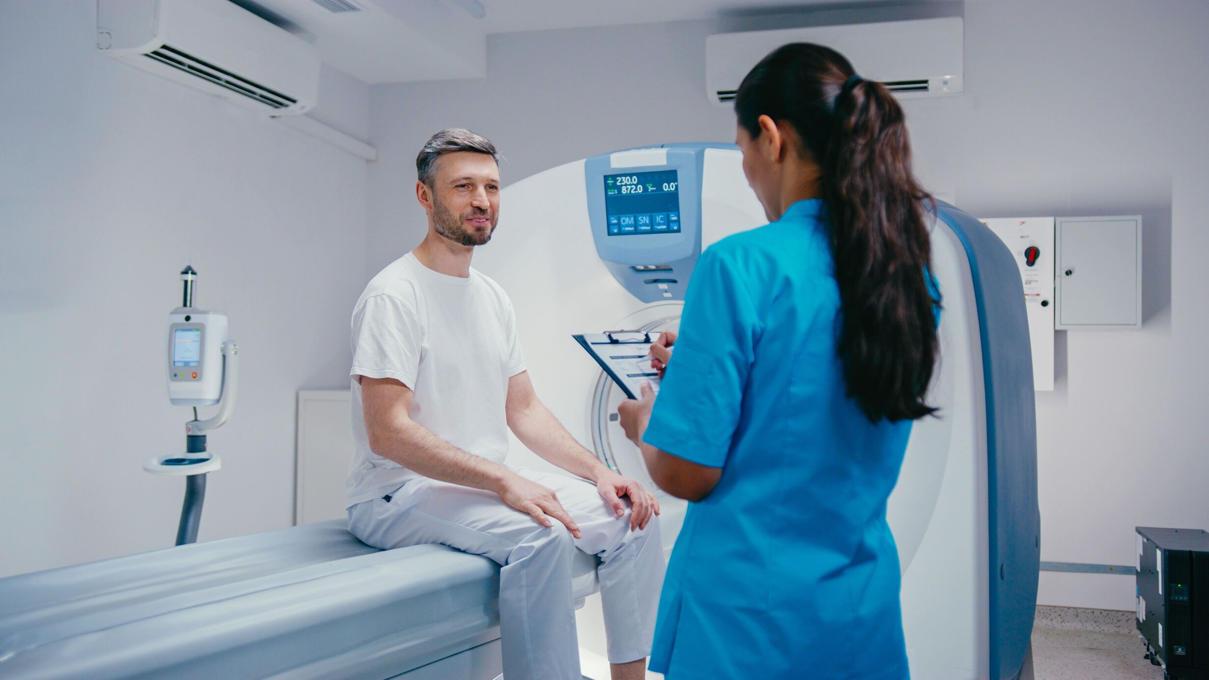 Patient at a CT scanner