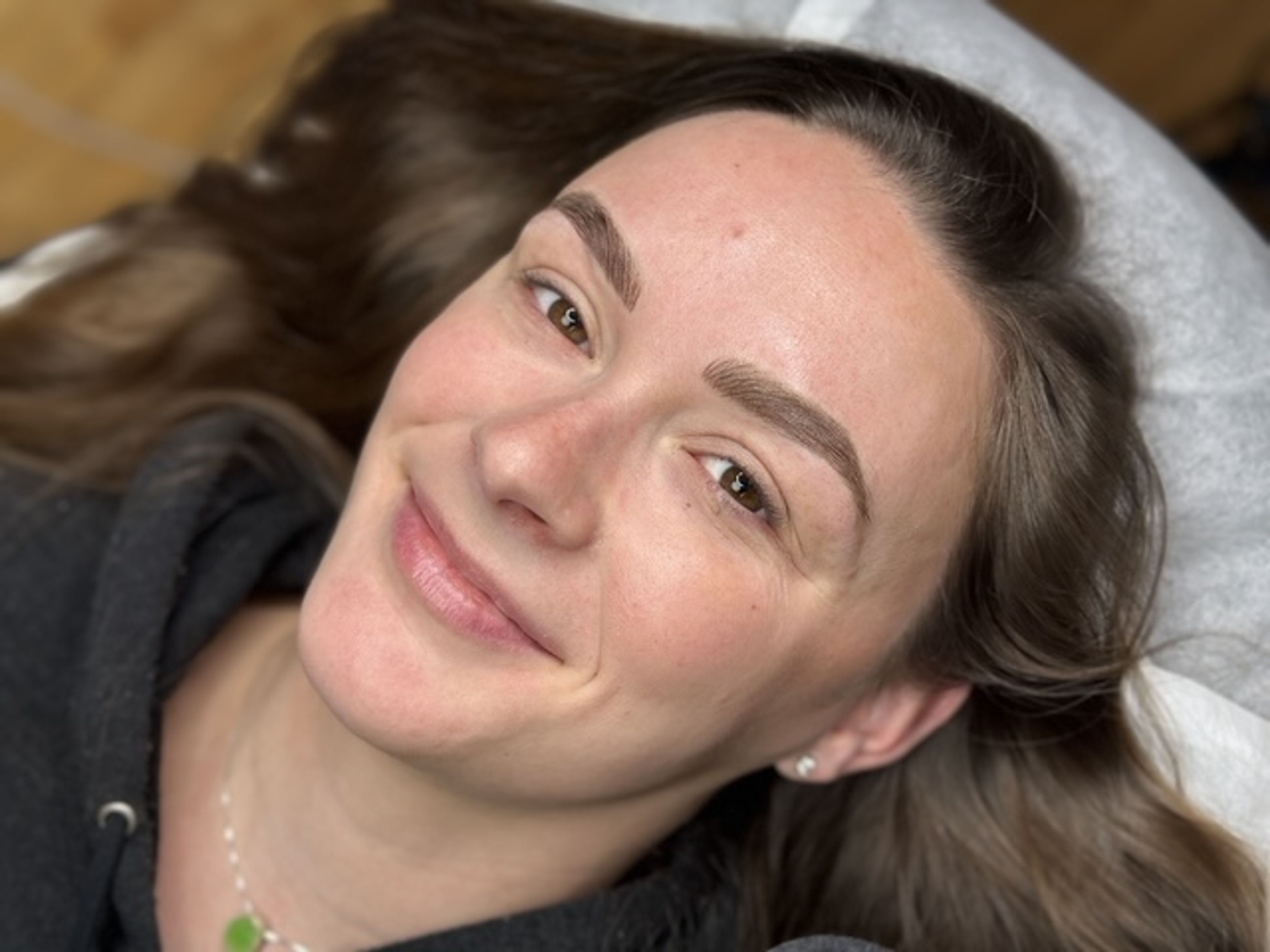 Combo Nano Brows on a melanin-rich person done at MOKO Beauty by Molly Normandin