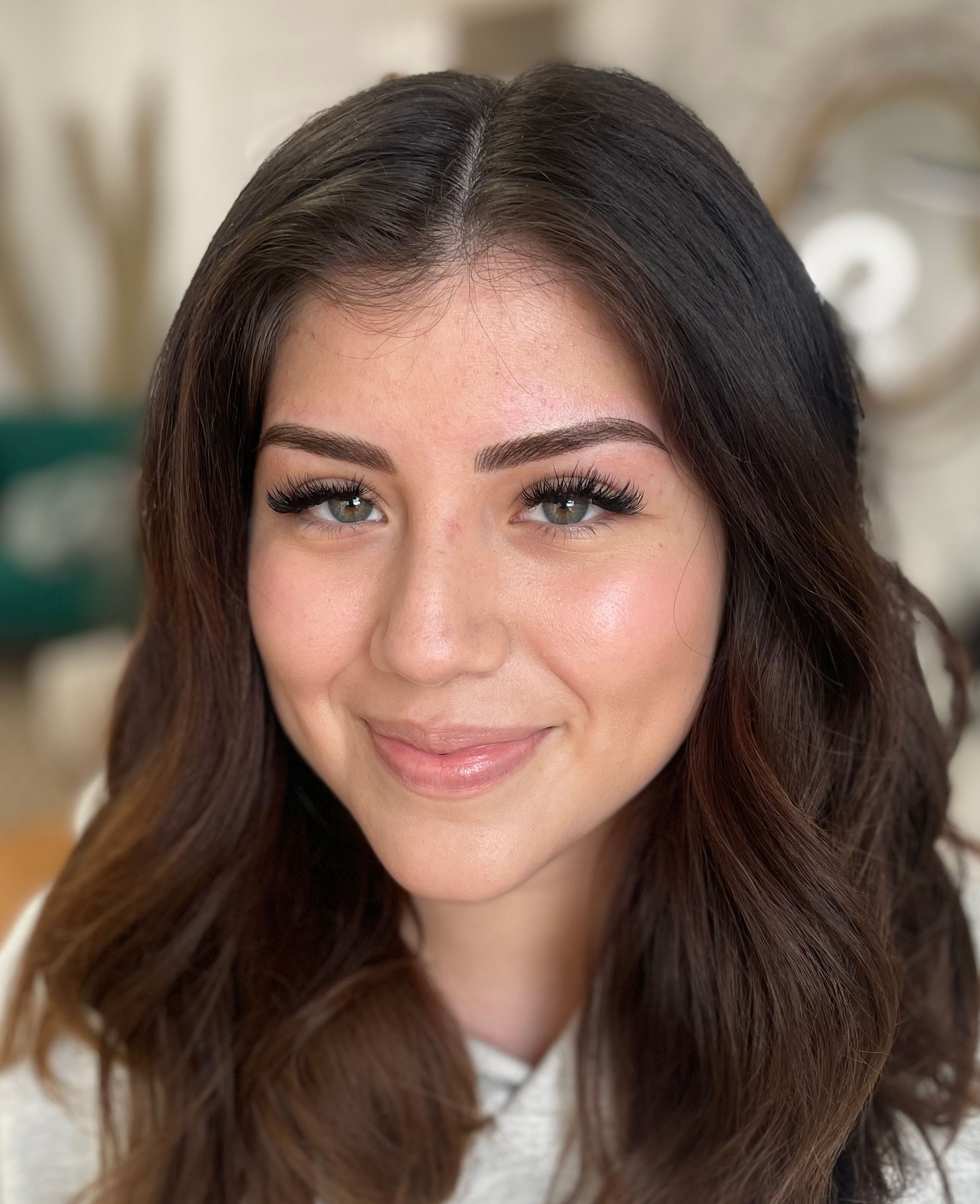 Healed microbladed eyebrows on green-eyed client with dark brown hair — natural hair stroke brow tattoo by MOKO Beauty Boston