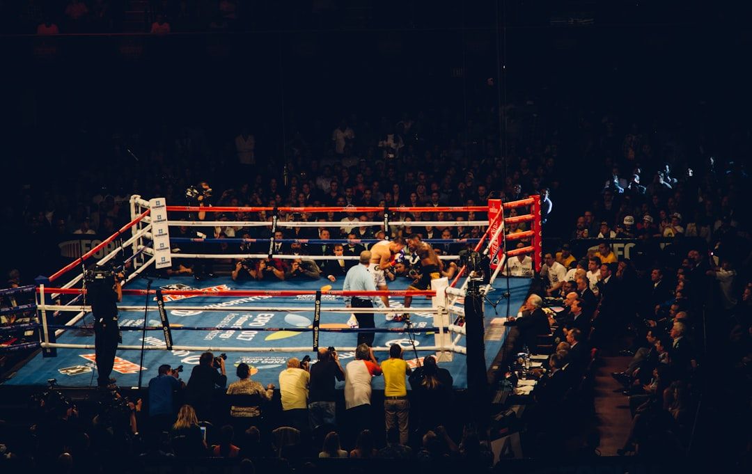Boxing fight night arena with dramatic lighting