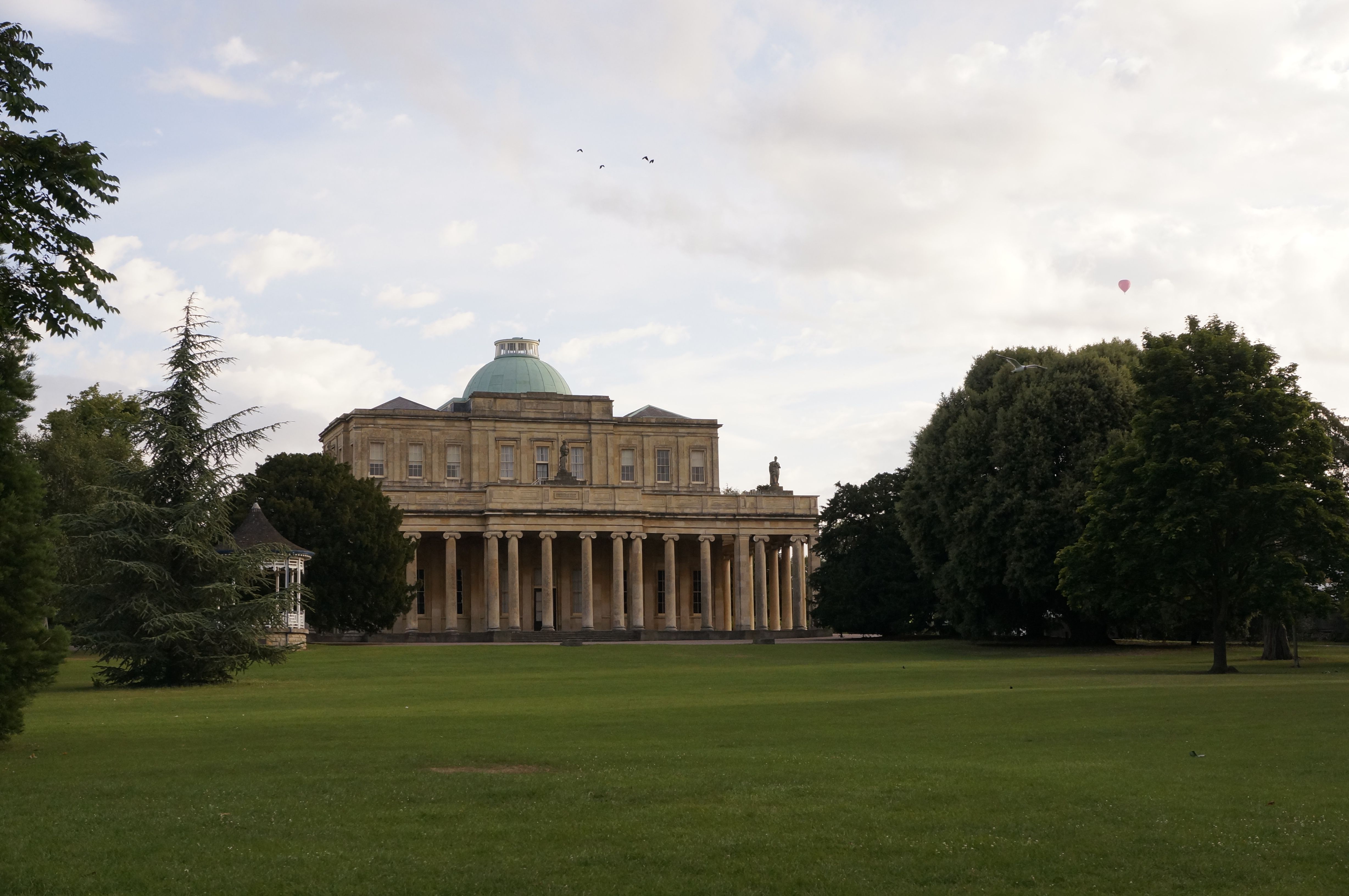 The Pittville Pump Room, Cheltenham's grandest Regency building, seen across Pittville Park