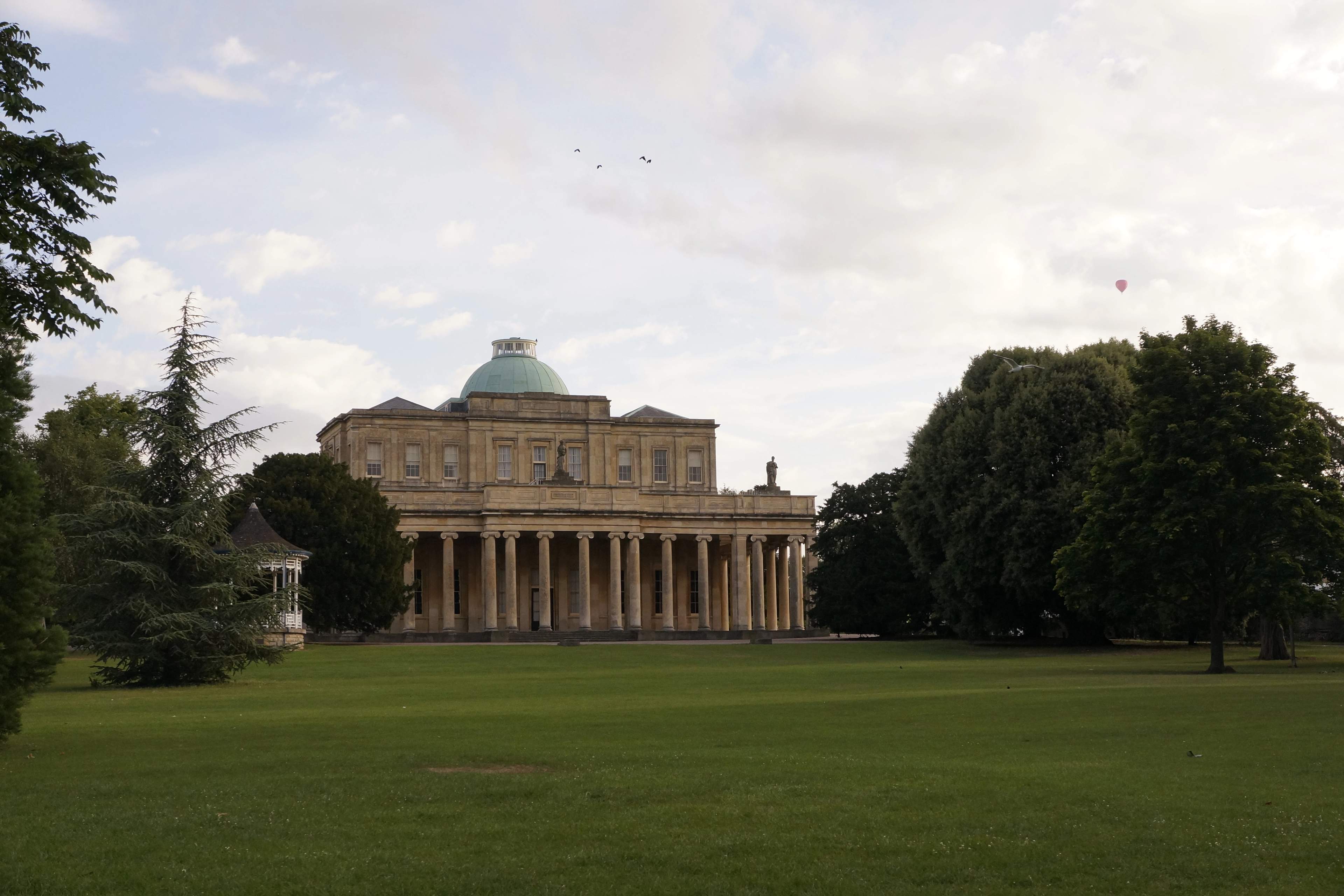 The Pittville Pump Room, Cheltenham's grandest Regency building, seen across Pittville Park