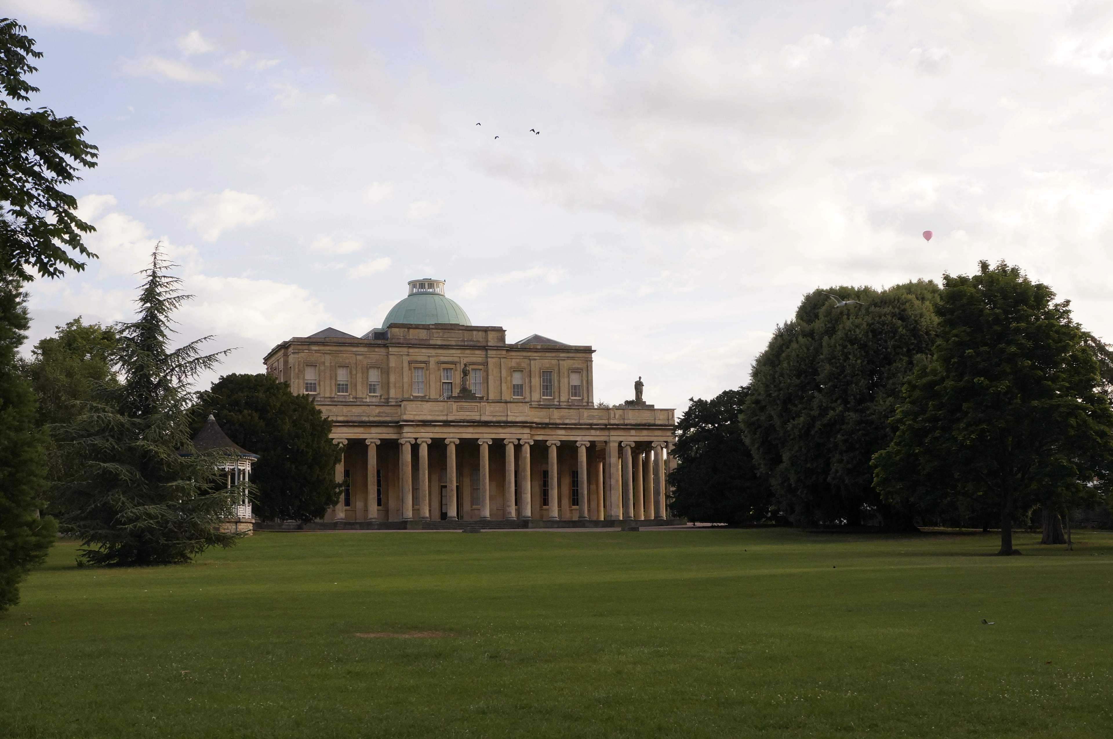 The Pittville Pump Room, Cheltenham's grandest Regency building, seen across Pittville Park