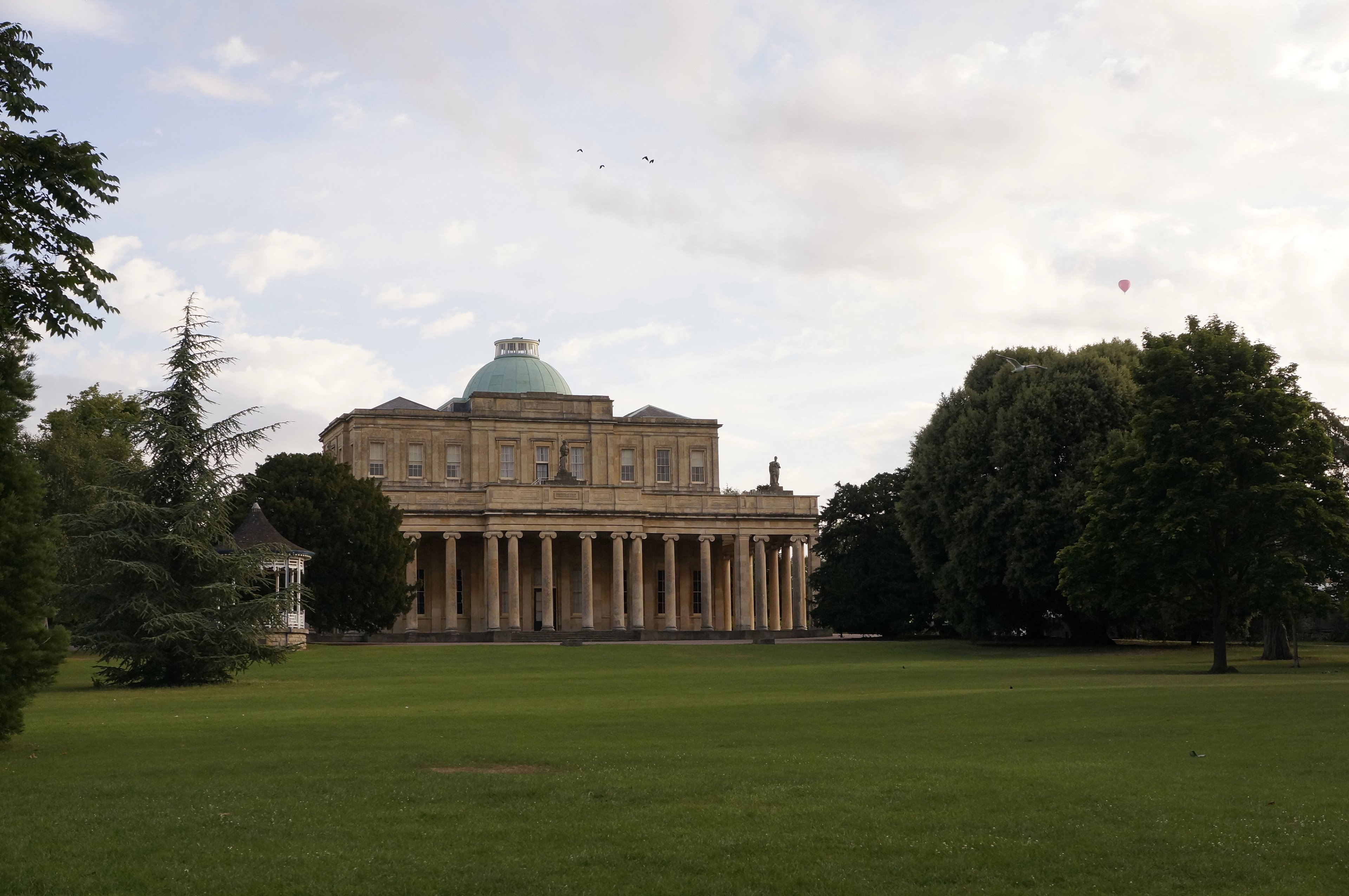 The Pittville Pump Room, Cheltenham's grandest Regency building, seen across Pittville Park