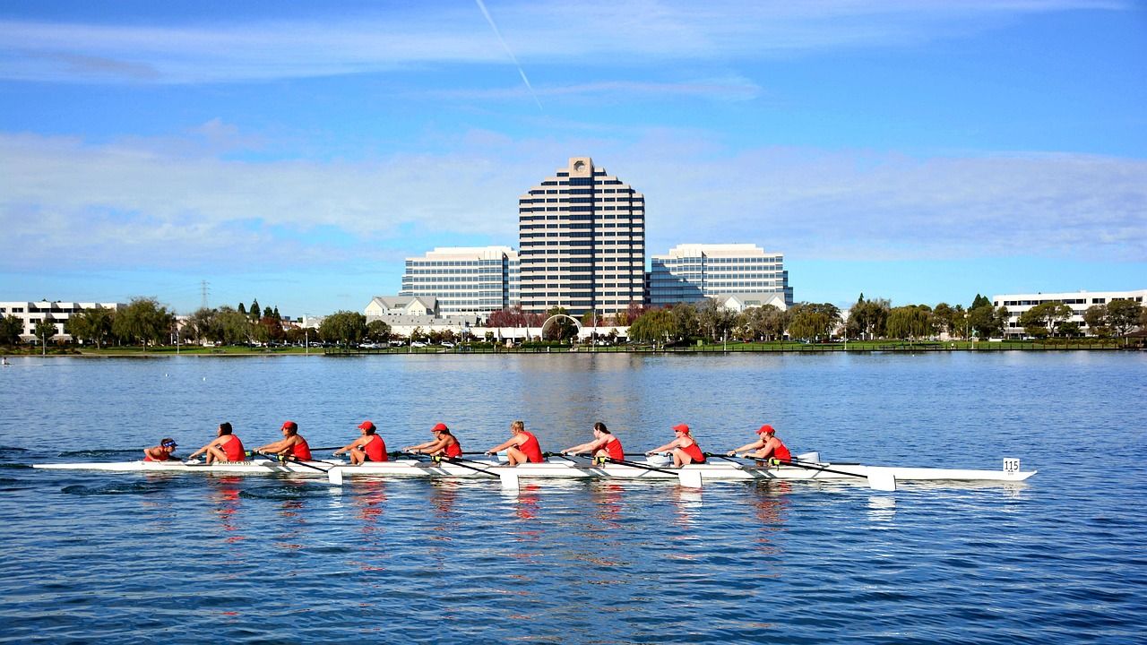 Rowing eights racing on the water, evoking the Grand Challenge Cup tradition
