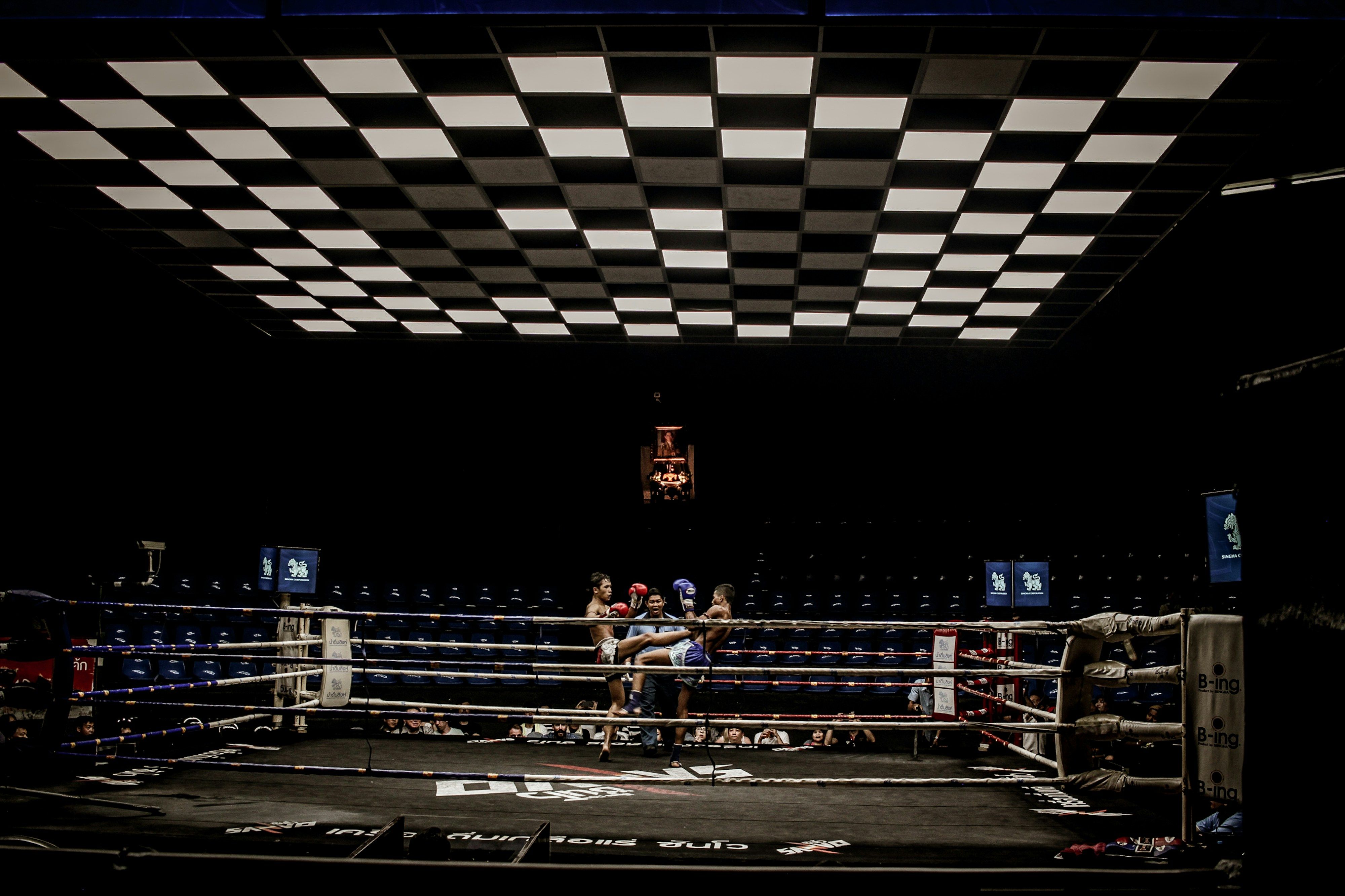 Two boxers exchanging punches in the ring