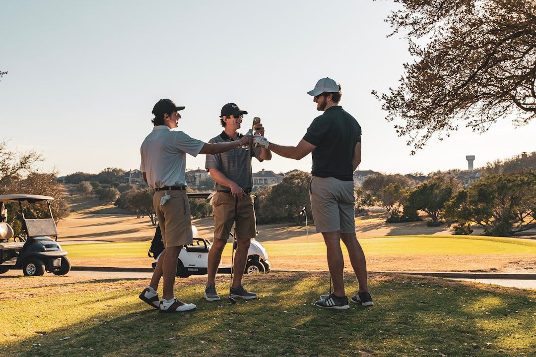 A golfer playing a shot on the course