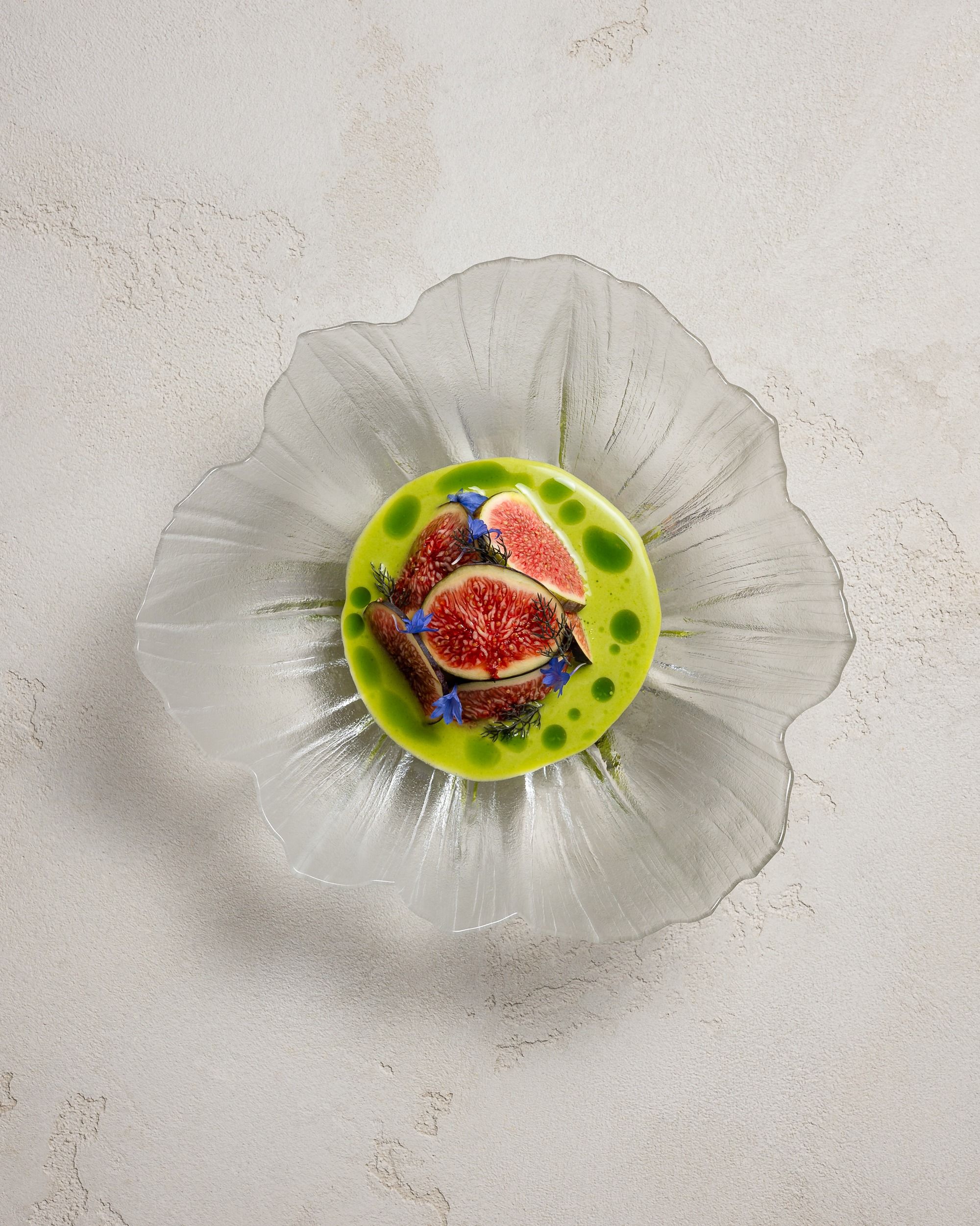 Bluefin tuna tartare with fresh figs in a green apple and fig leaf sauce, in a glass bowl, at HIDE