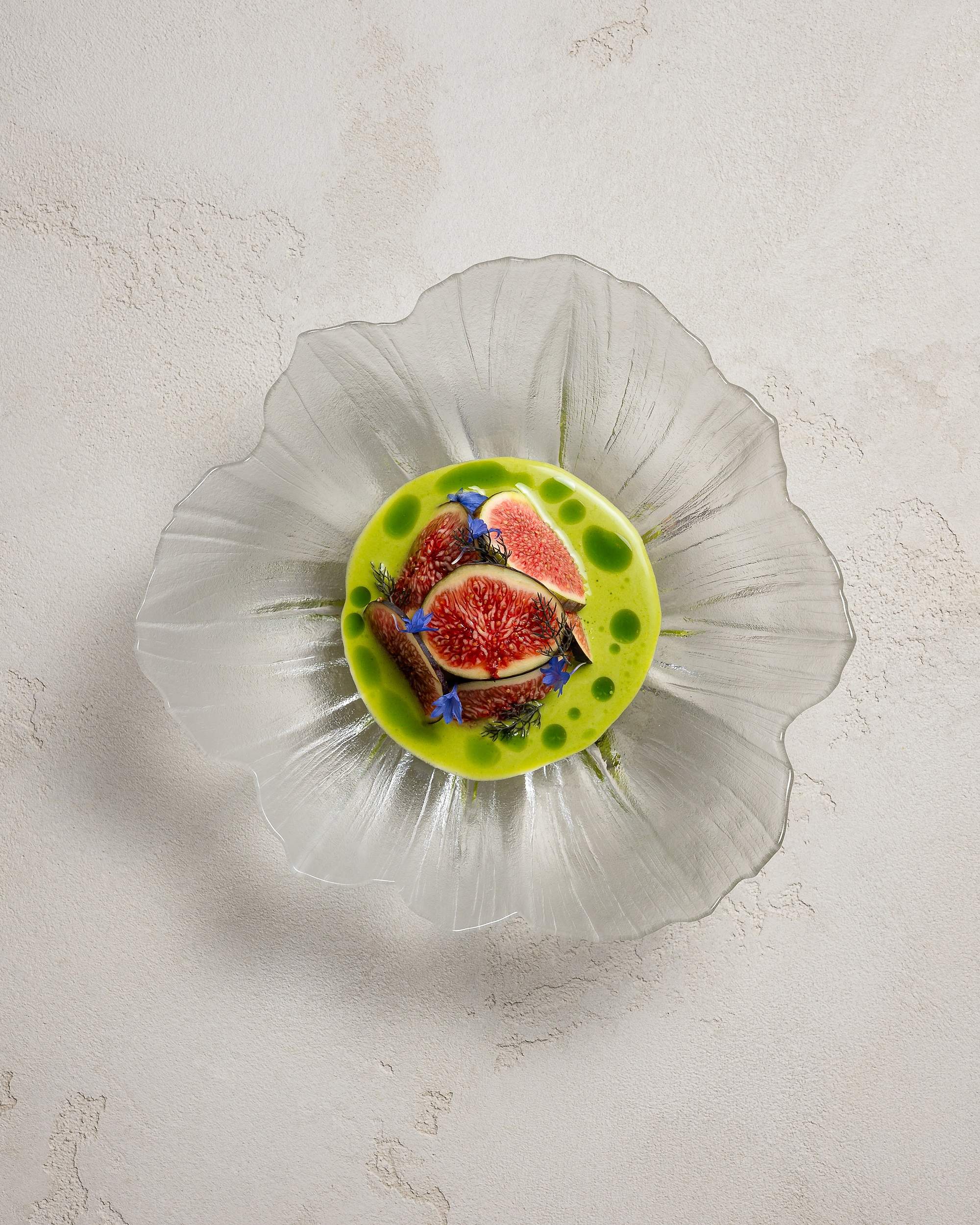 Bluefin tuna tartare with fresh figs in a green apple and fig leaf sauce, in a glass bowl, at HIDE