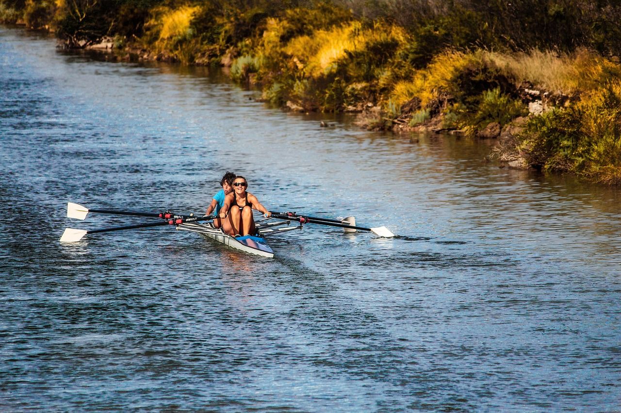 Rowers on a river, representing the expanding international field at Henley Royal Regatta