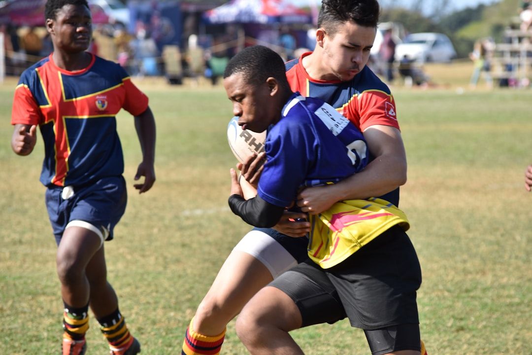 Rugby sevens tackle action during a fast-paced match