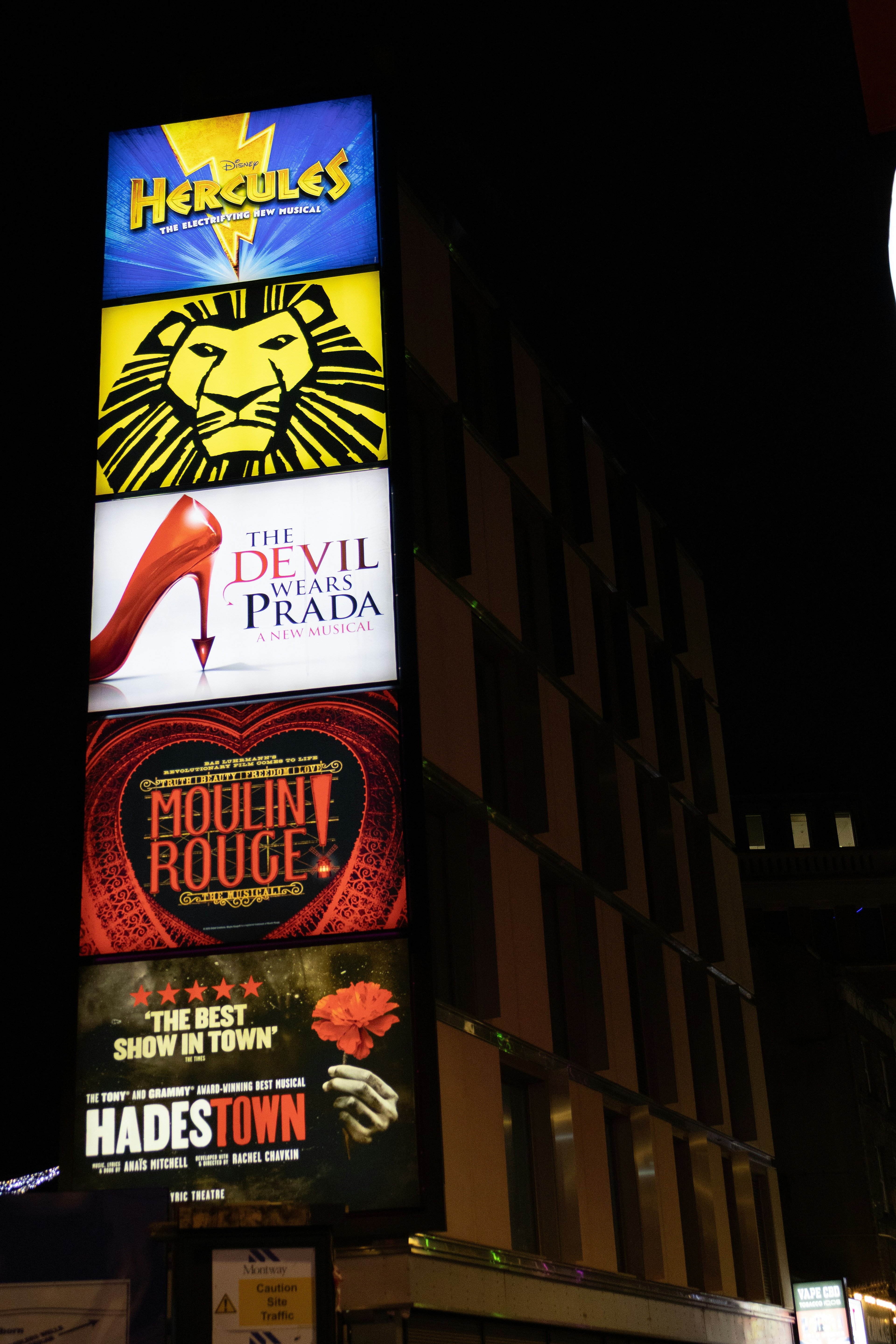 Broadway theatre marquee lit at night