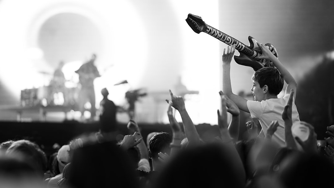 Fans enjoying a rock concert with excitement
