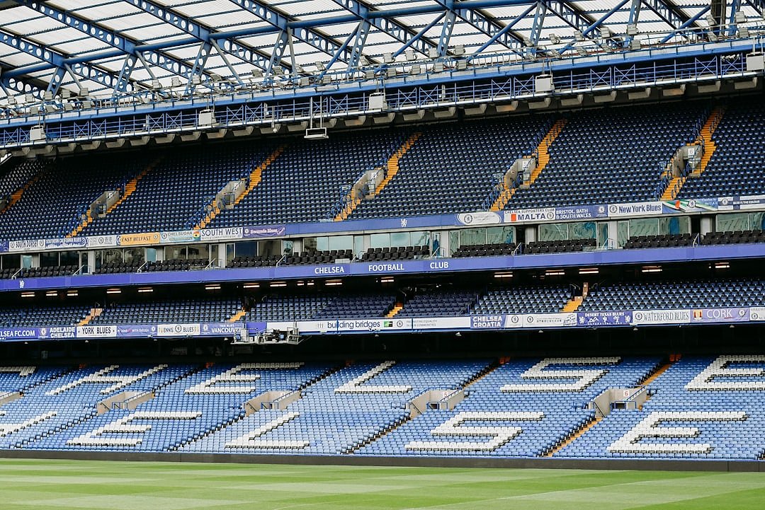Stamford Bridge stadium interior with rows of blue seats