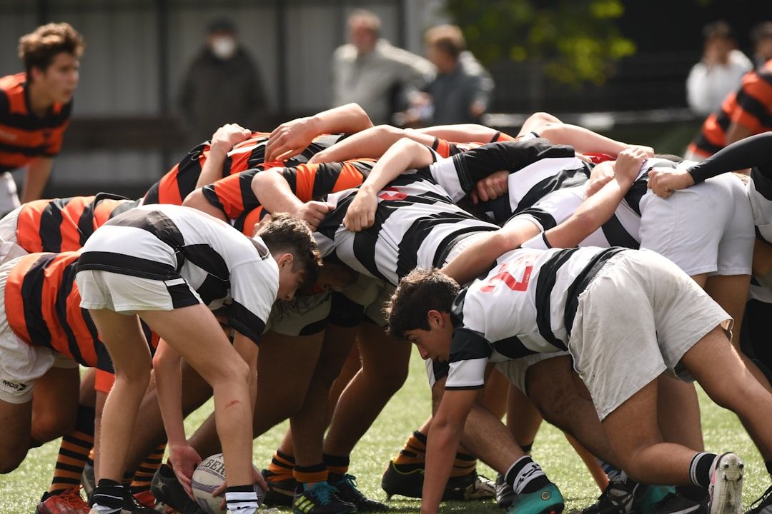 Rugby players forming a scrum, representing the early era of international rugby