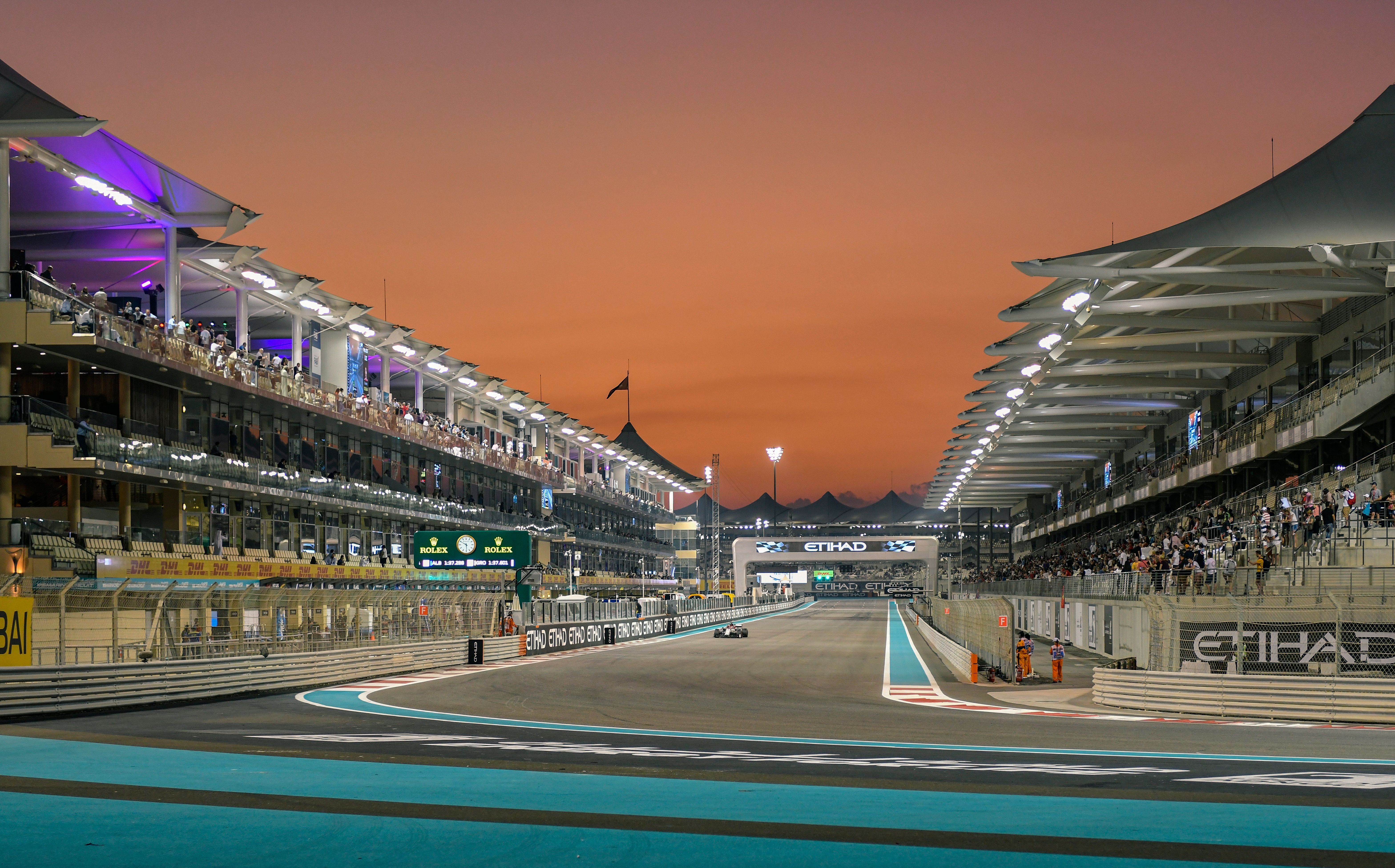 Grandstands lining the main straight at Yas Marina Circuit at sunset during the Abu Dhabi Grand Prix