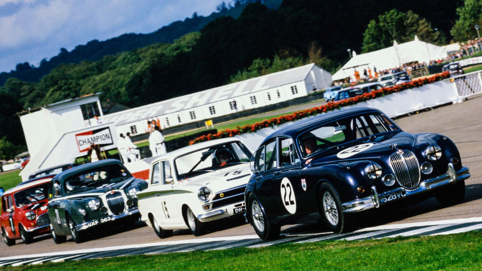 Classic saloon cars racing in the St Mary's Trophy at the Goodwood Revival