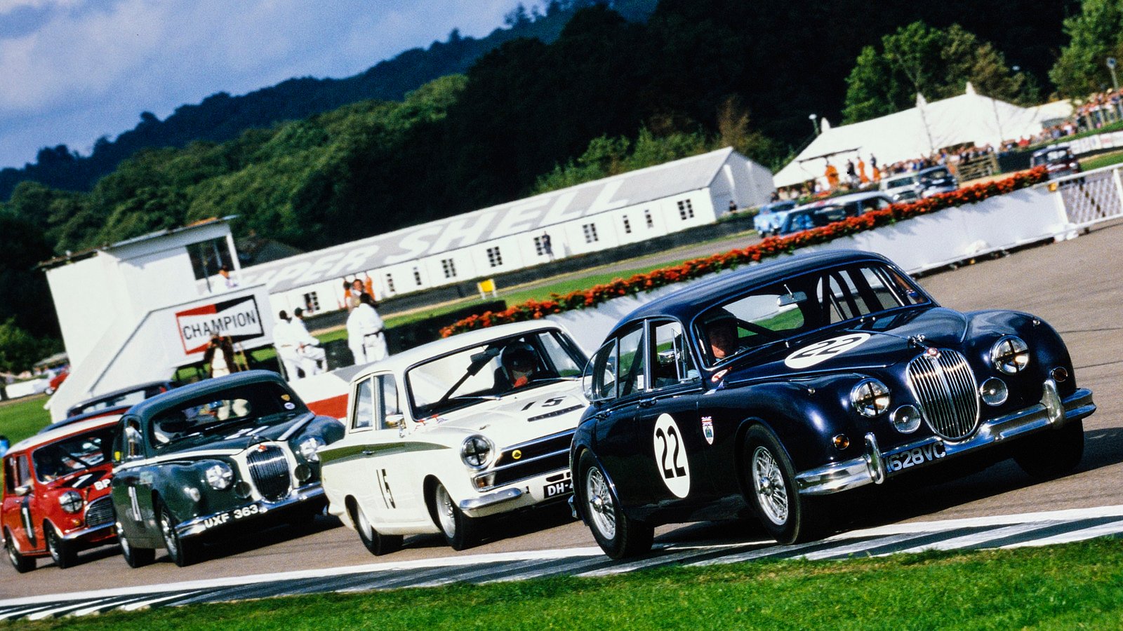 Classic saloon cars racing in the St Mary's Trophy at the Goodwood Revival