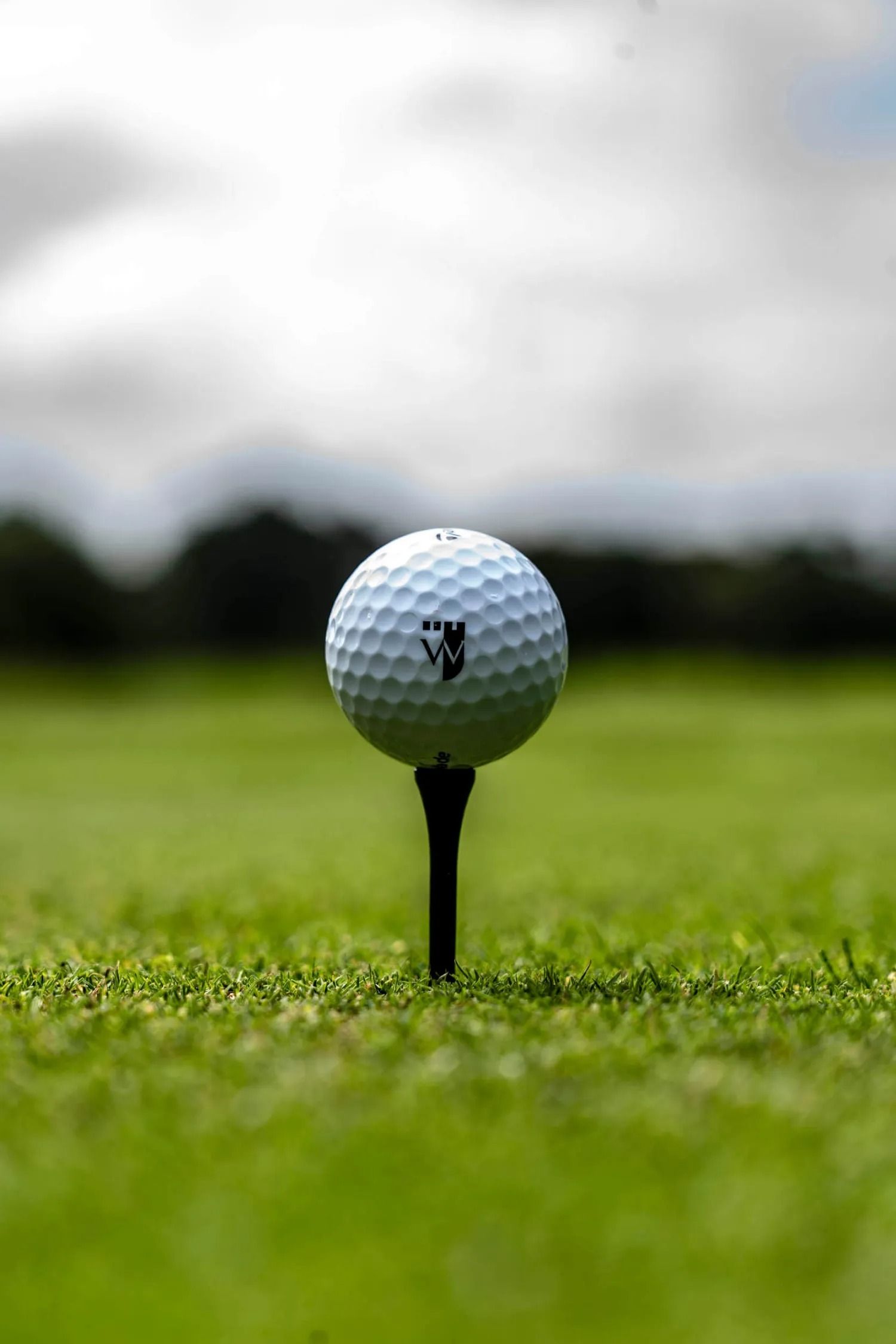 Wentworth branded golf ball on tee
