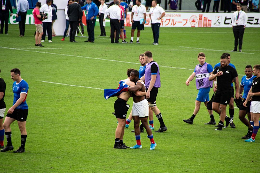 Rugby players shaking hands after a match, representing the spirit of the fixture