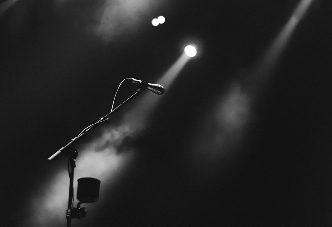 Microphone on a foggy stage with dramatic lighting