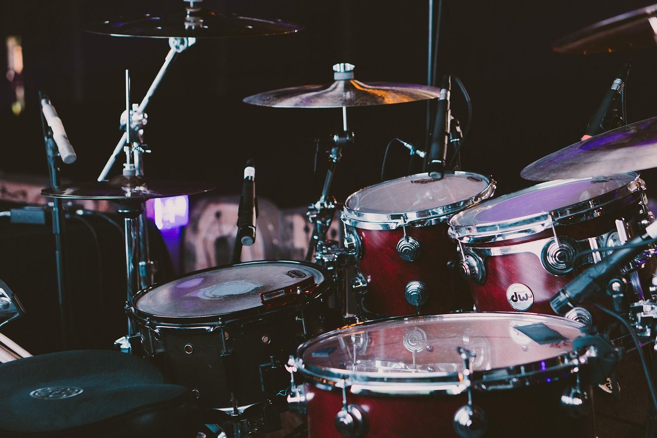 Drum kit on a concert stage, representing Queen's live performance setup