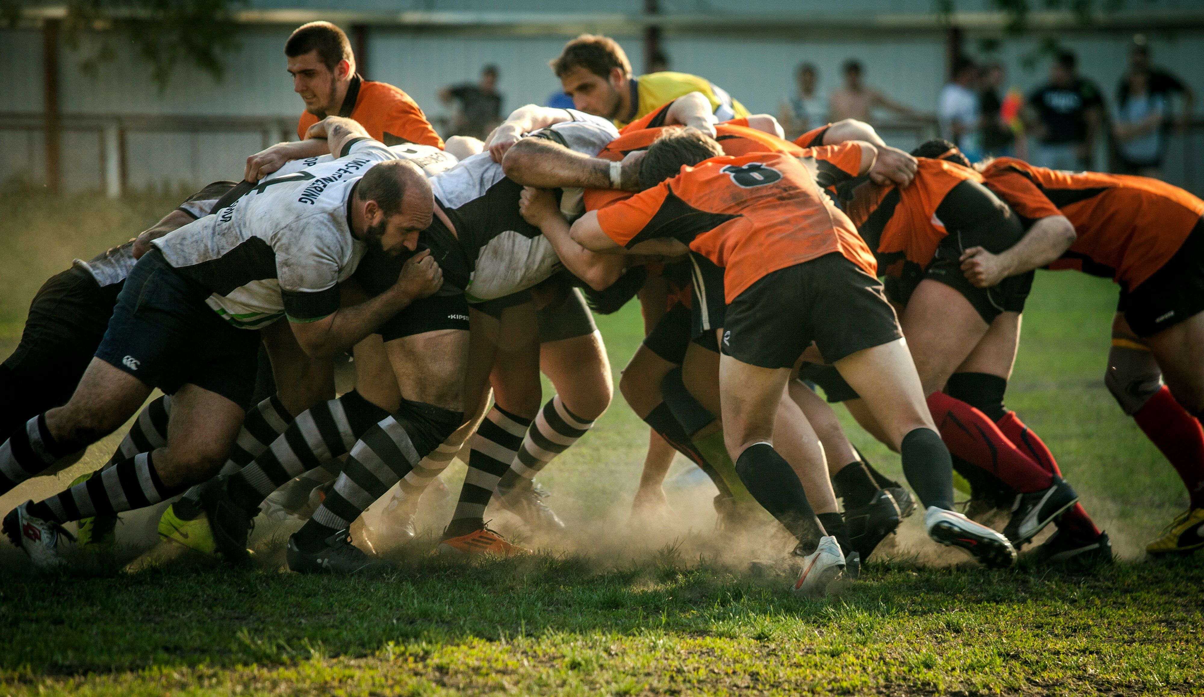 Players competing on a grass pitch