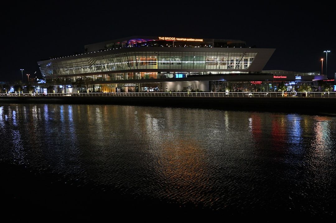 The Yas Hotel illuminated at night beside Yas Marina Circuit