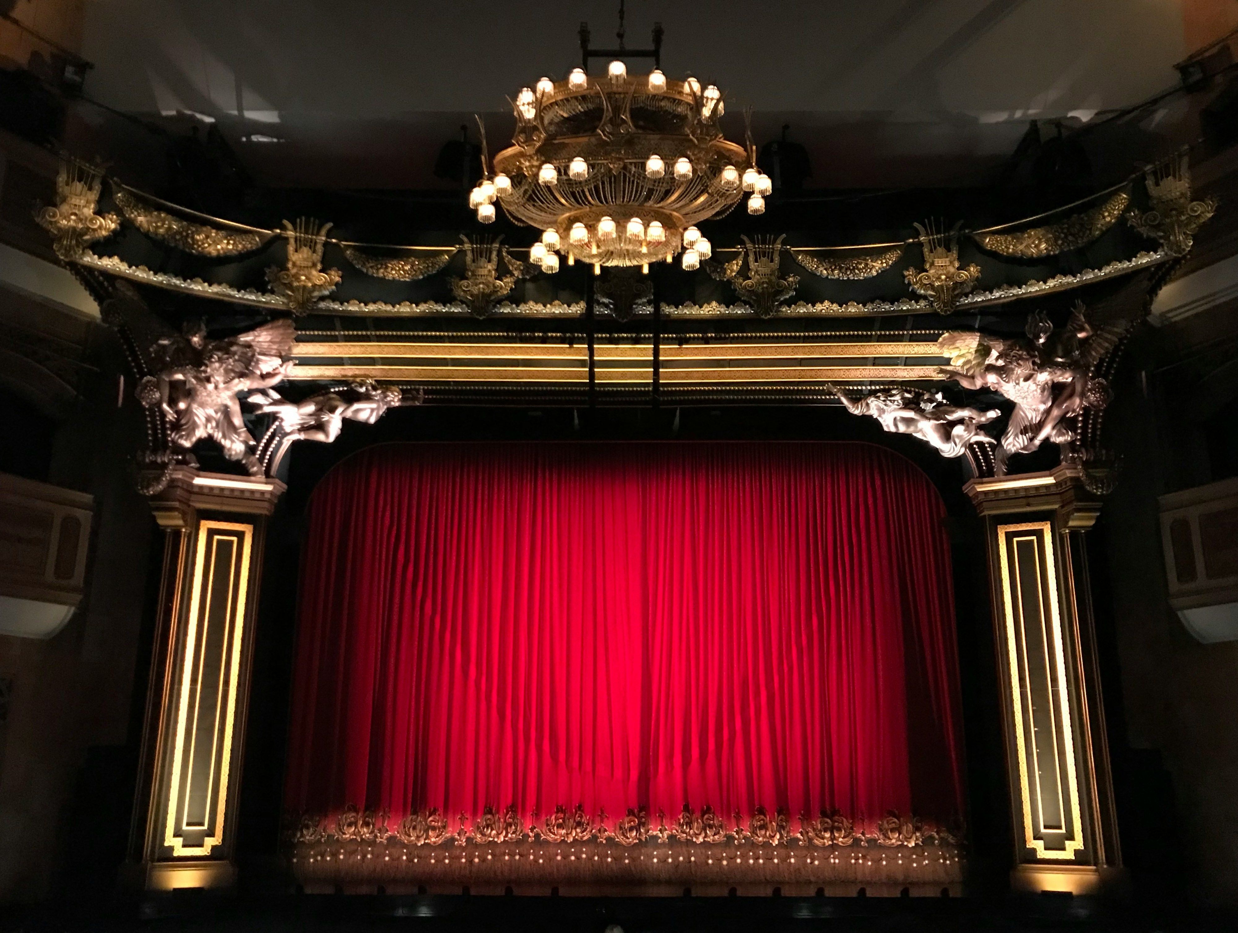 Red curtain on a musical theatre stage