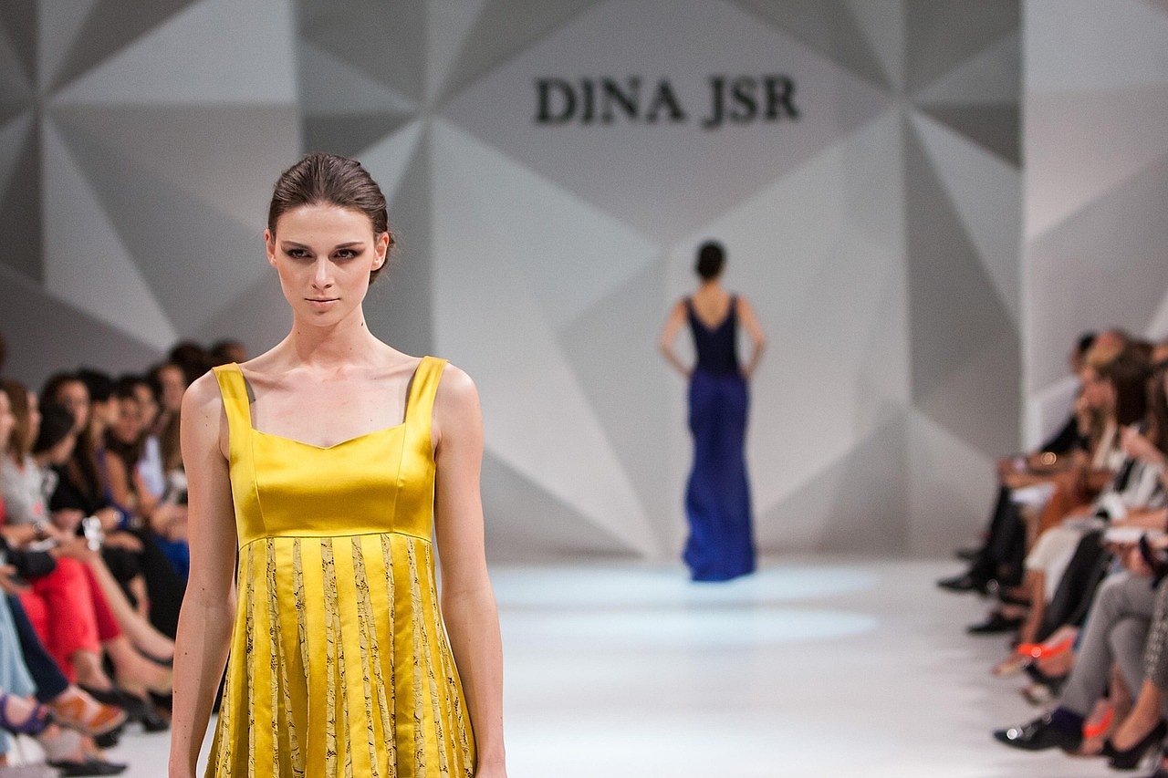 Fashion show catwalk scene reflecting the high-fashion world of the Devil Wears Prada franchise